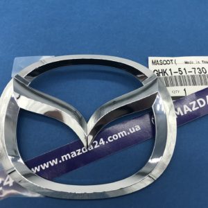 GHK151730 - Оригинальная эмблема крышки багажника (логотип Mazda) на Mazda 6 седан 2012-2017