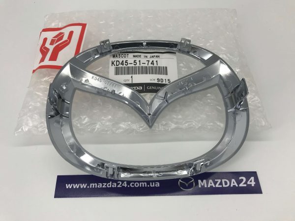 Эмблема передняя Mazda CX-5 KE, CX-9 TB – KD4551741. Вид с обратной стороны.